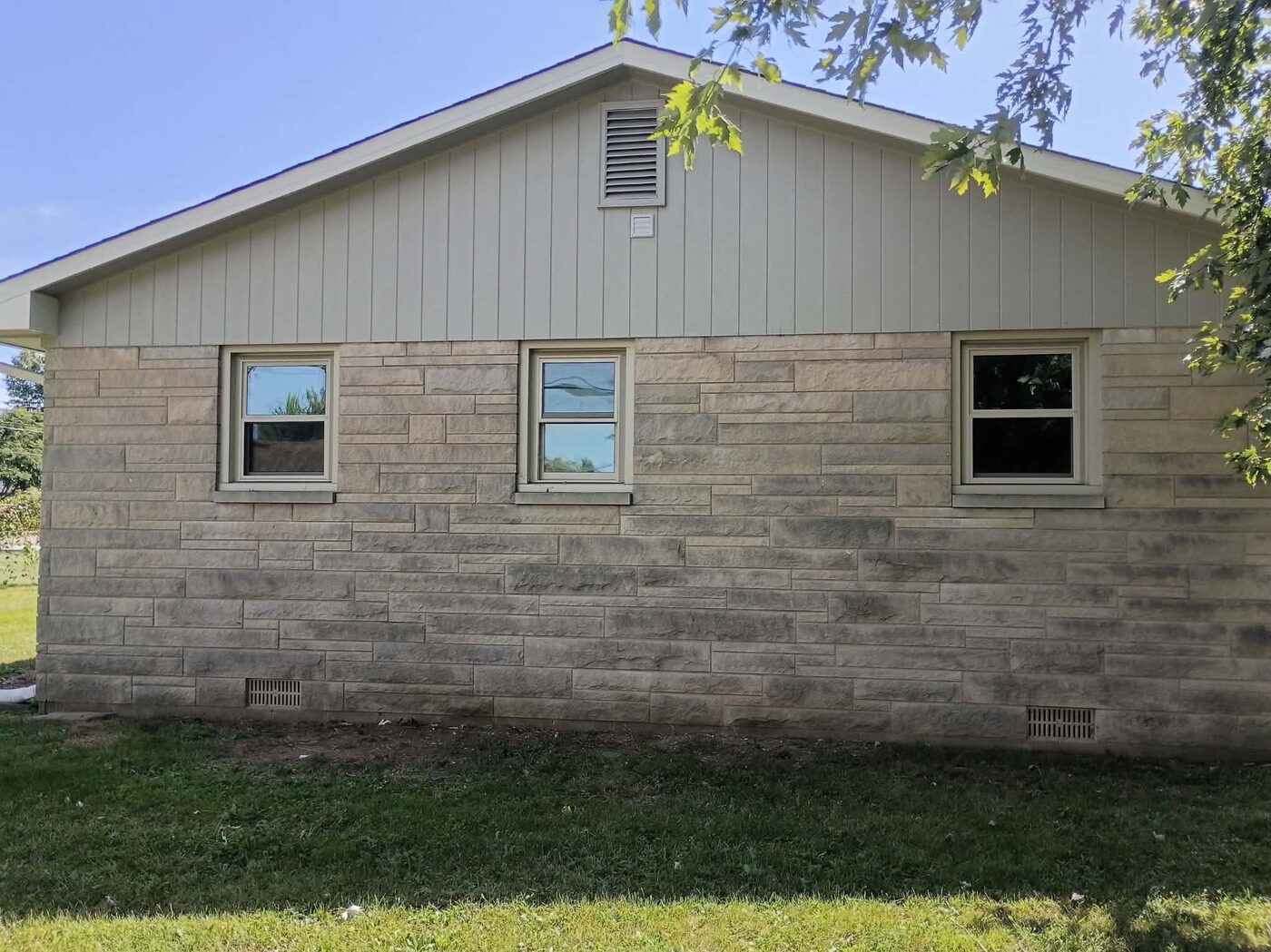 Same side exterior after painting, with a clean refreshed finish