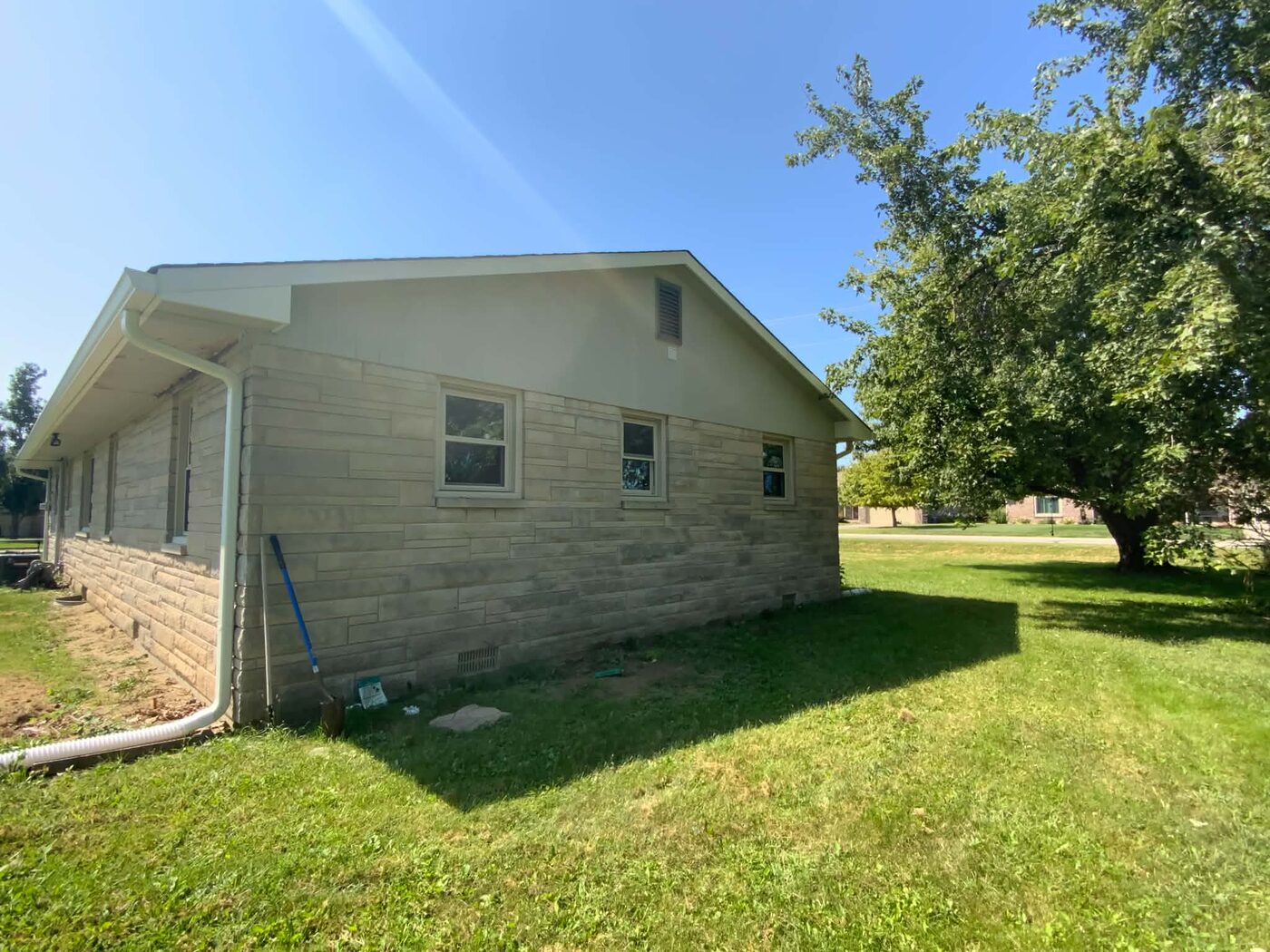 Side exterior before painting, showing the original siding